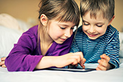 kids playing on tablet