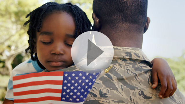 Military Veteran Hugging Child